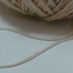 beige synthetic yarn strand