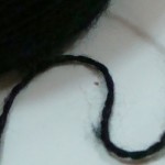 black yarn strand